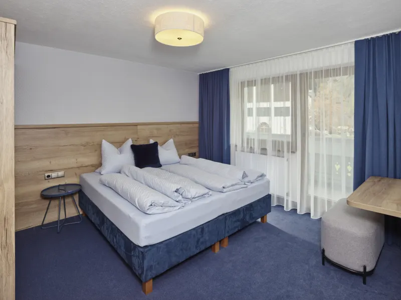 Zweites Schlafzimmer mit Doppelbett im Appartement Grieskogel